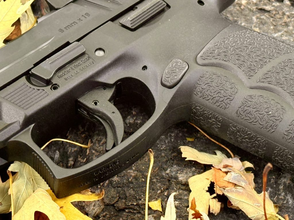 Close-up of the HK VP9 A1 button magazine release
