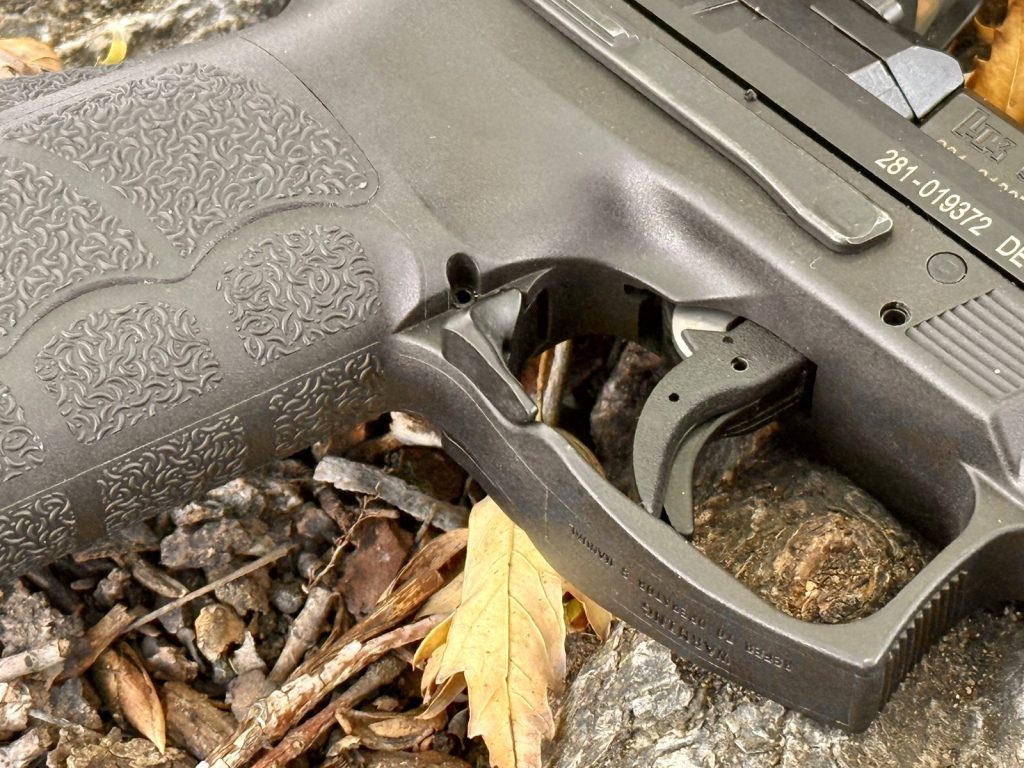 Close-up of the HK VP9 paddle magazine release