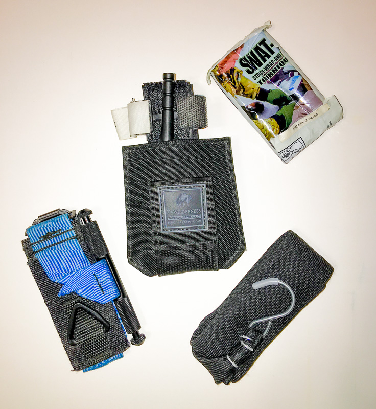 PDQ-TQ Tourniquet Belt Pouch shown with a CAT and other common tourniquets