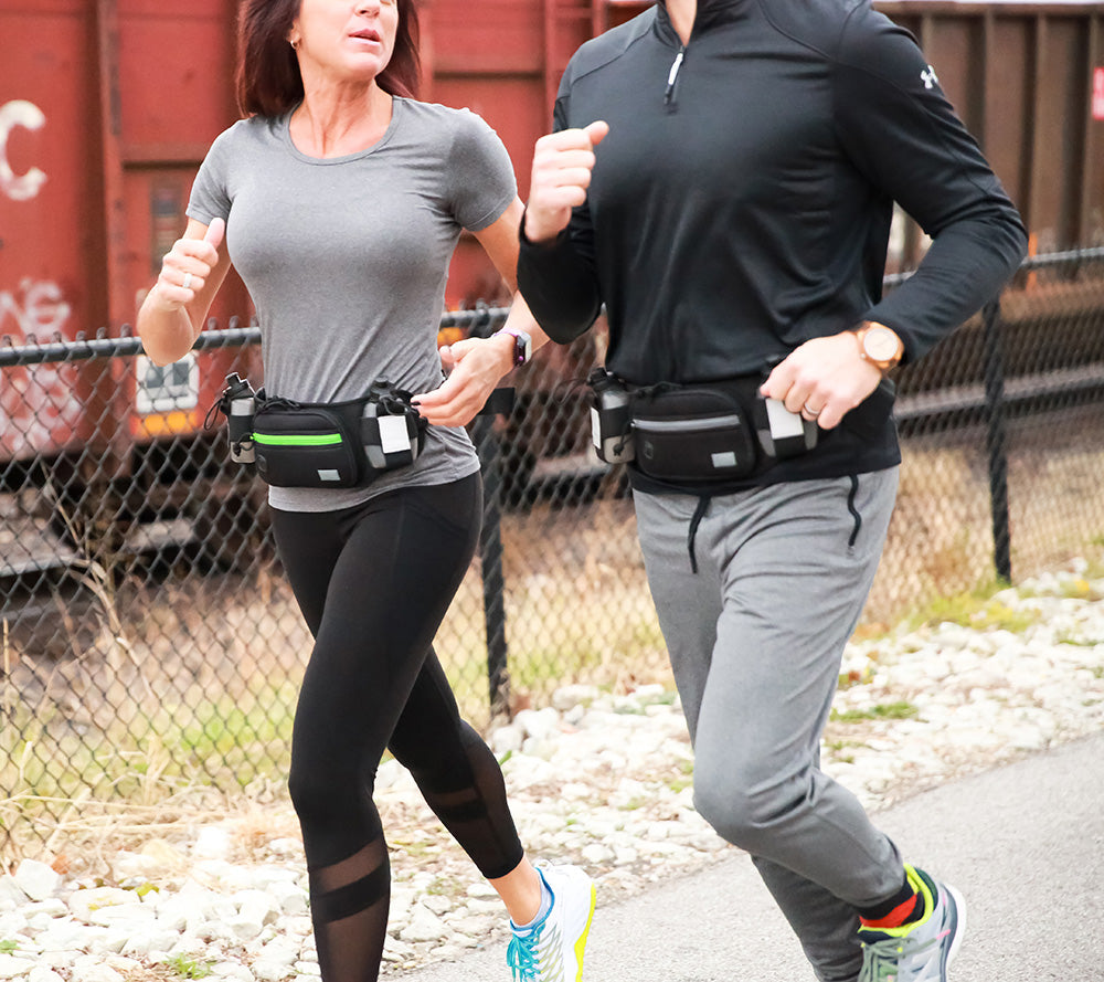 Two runners wearing the ESS Marathon Gun Pack